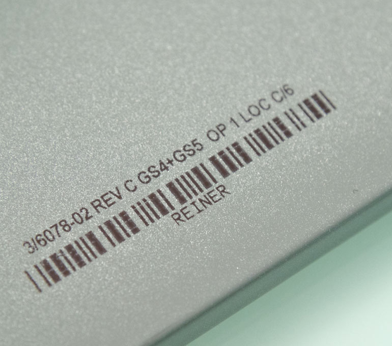 Metal with barcode and part numbers