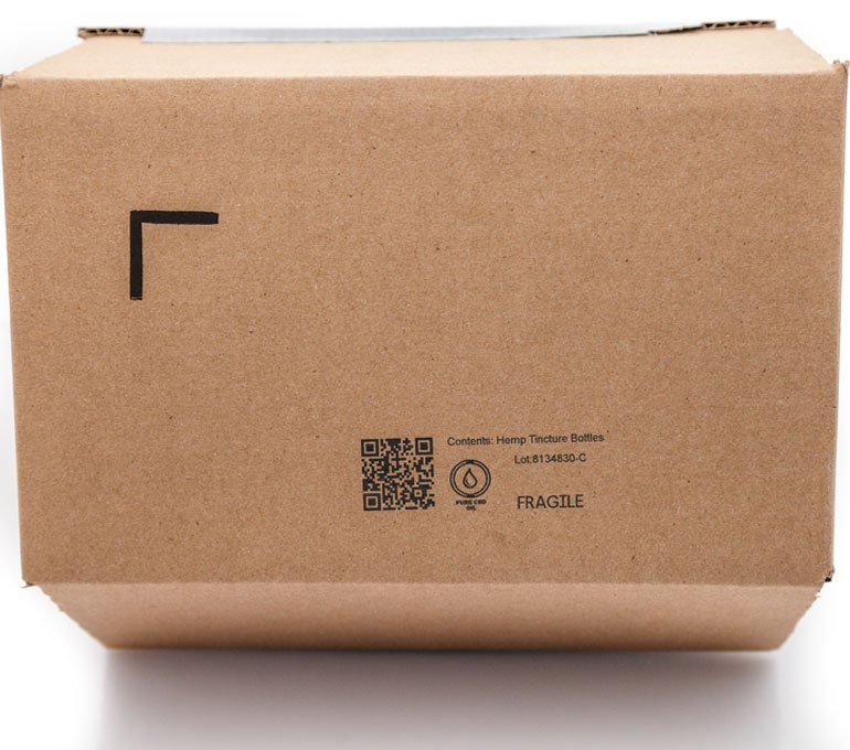 cardboard box with QR code, graphic, text and lot number