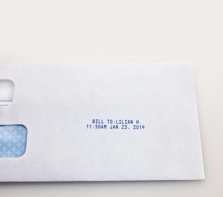 envelope with bill-to name, time, and date