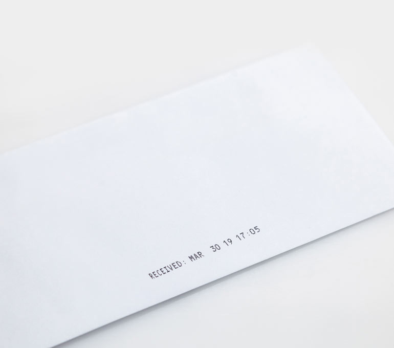 Envelope with imprint of received date and time