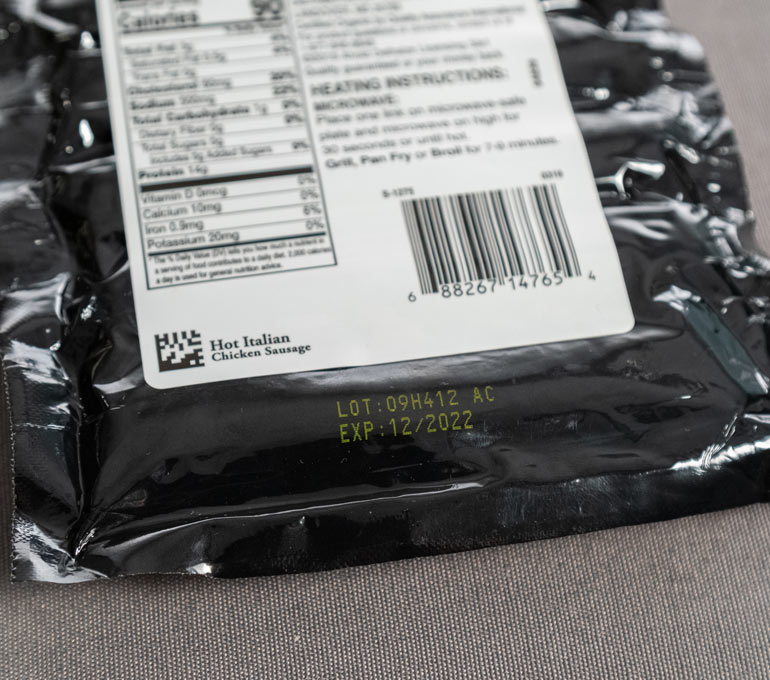 black plastic pouch with yellow ink imprint of lot number and expiration date