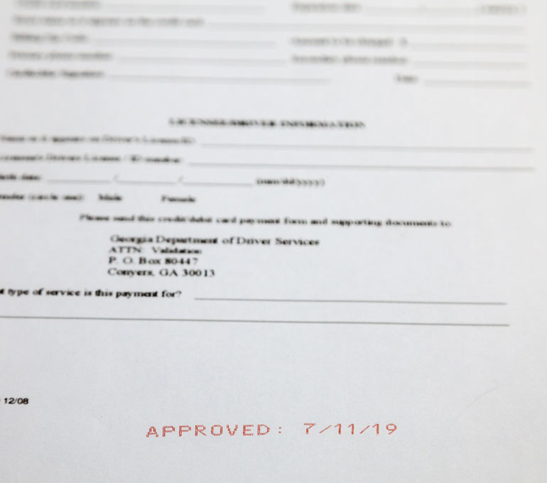 Form with Approved Date in red ink