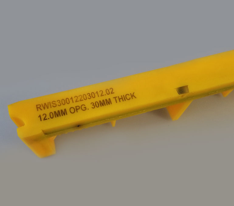 yellow plastic with serial number and dimensions