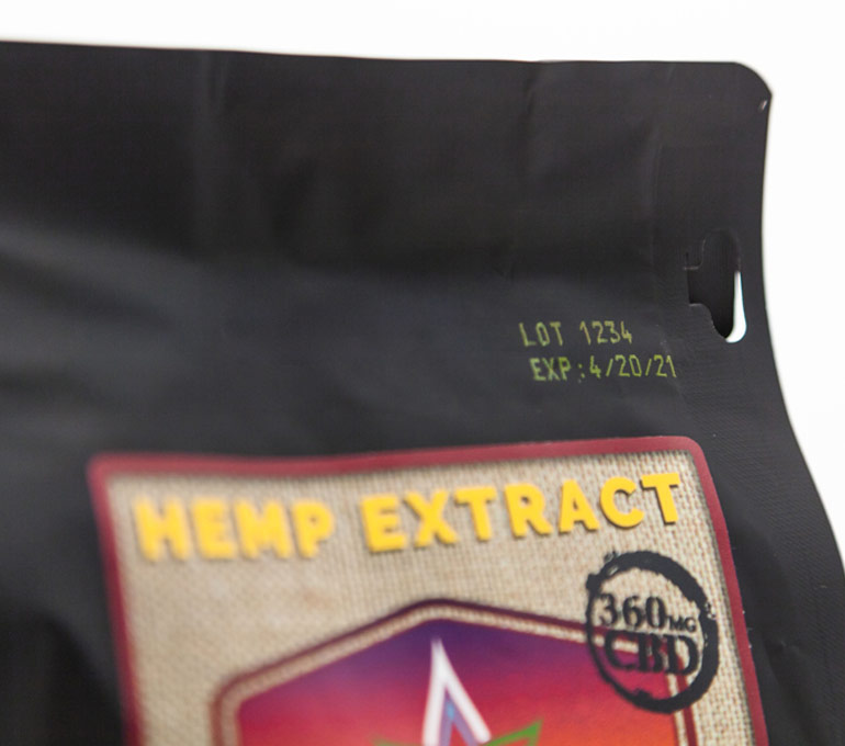 hemp extract bag with lot number and expiration date in yellow ink