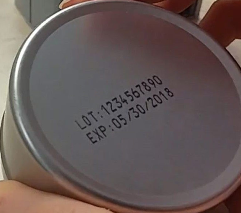 metal can bottom with lot number and expiration date