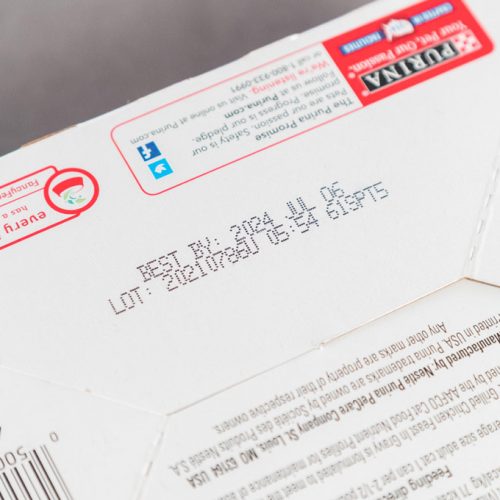 cardboard box purina with best by date and lot number