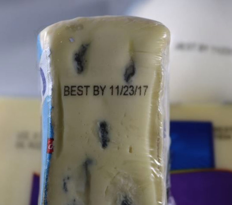 plastic wrapped blue cheese with best by date